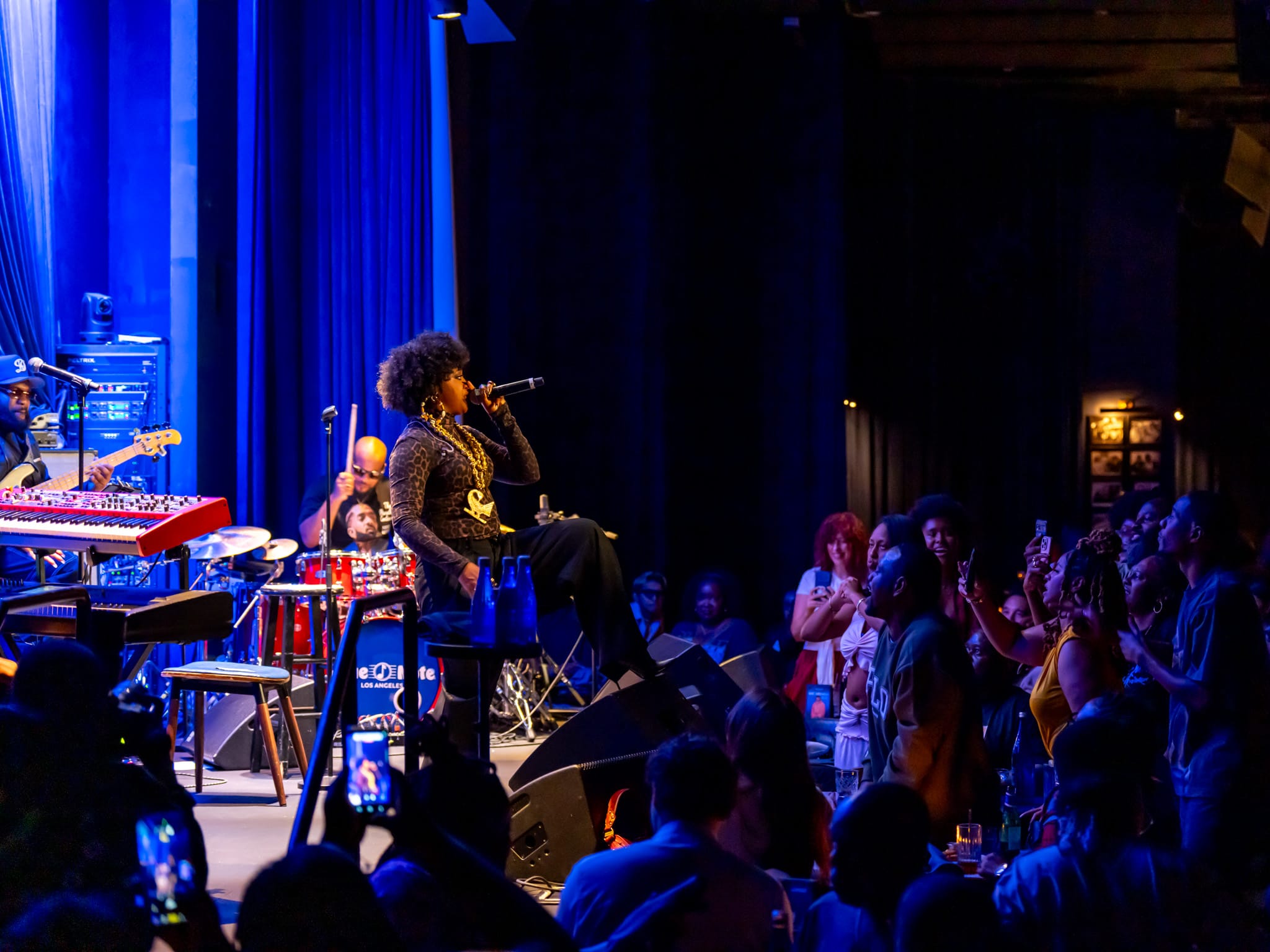 Rapsody and her band performing on stage at Blue Note Los Angeles